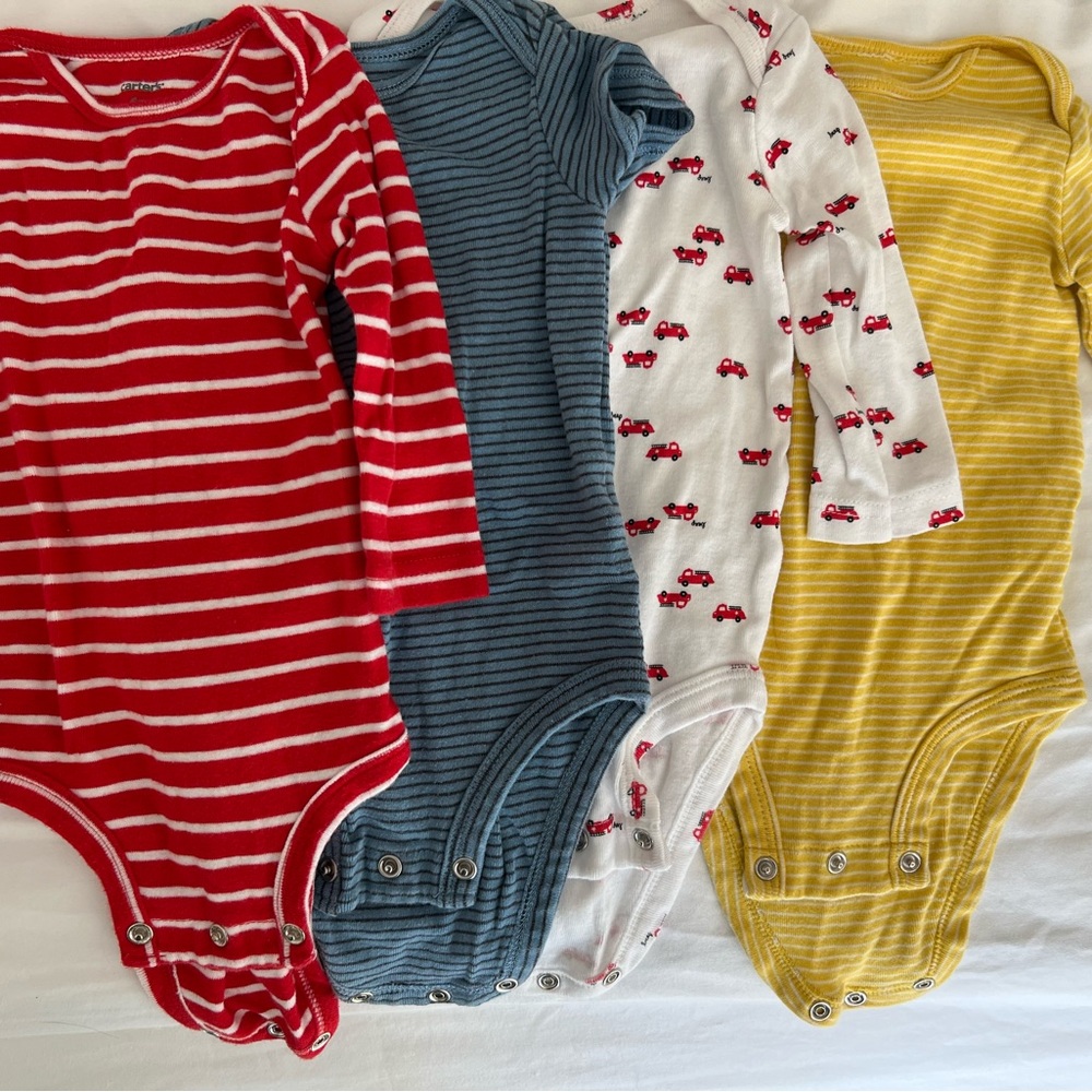 6 month onesies 3 long sleeves and blue short sleeve. Perfect condition